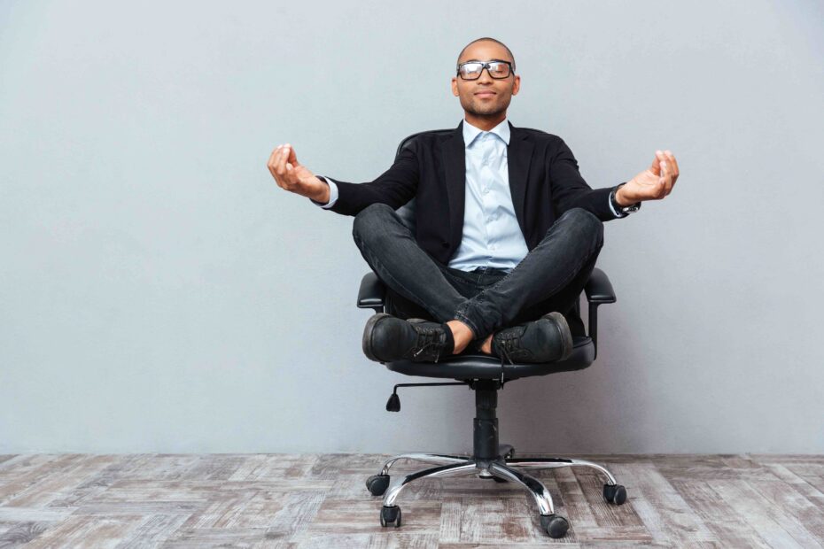 Guy Meditating in Office