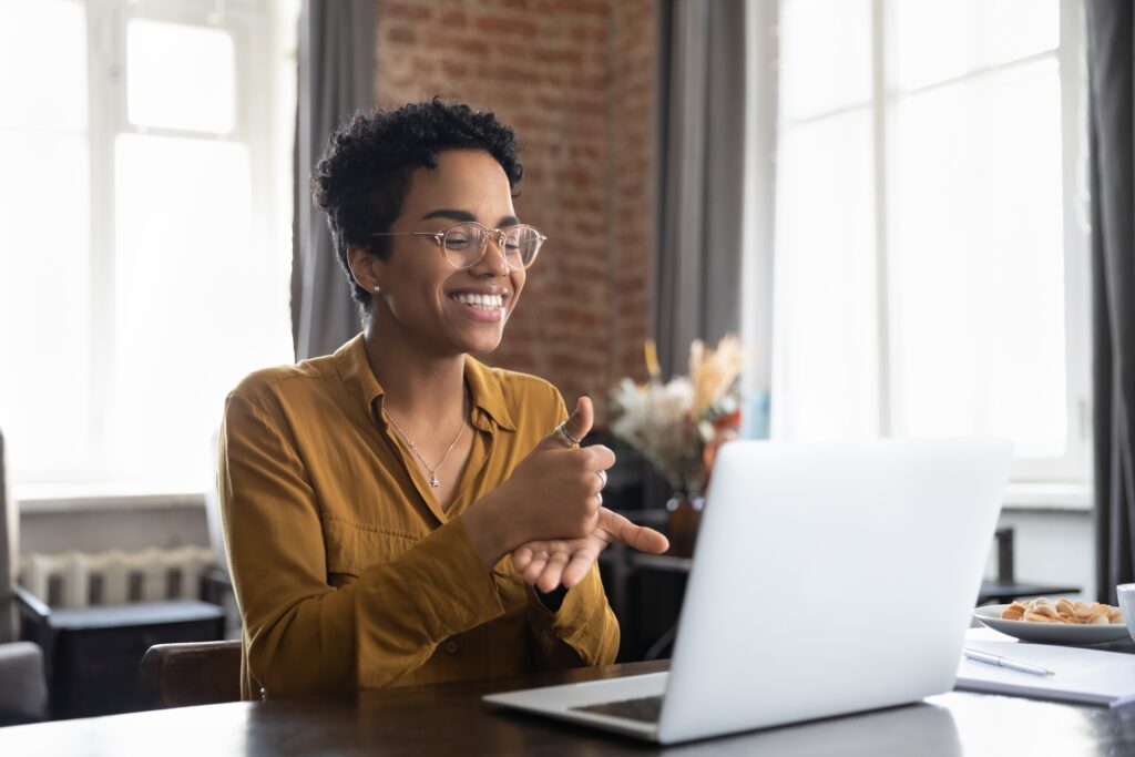 Woman at computer using sign language